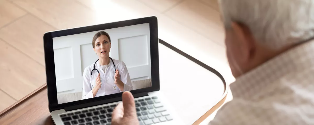 man and doctor on telehealth session