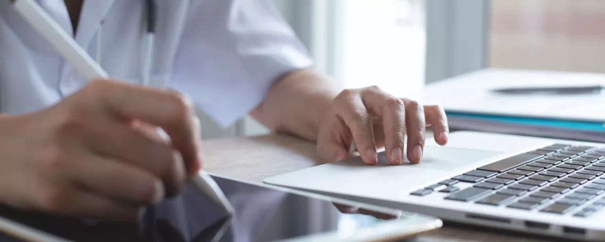 doctor using tablet and computer