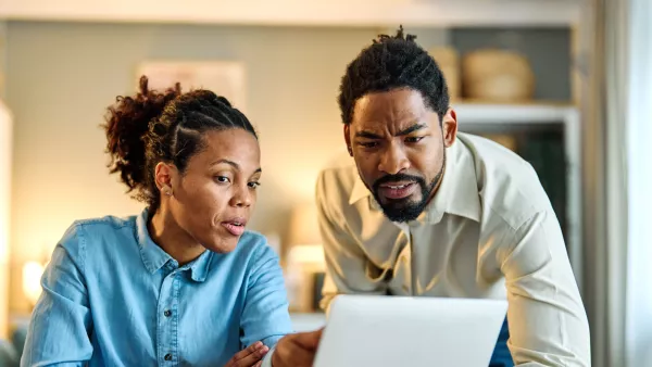 Woman and man looking at a computer