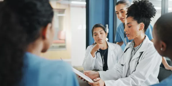 doctors looking at tablet