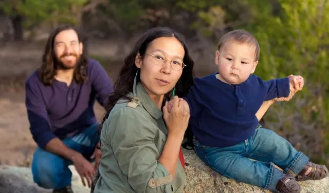 Family of three spending time outdoors. Tribal health partners.