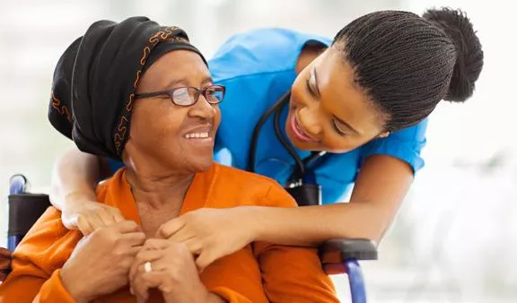 Doctor and patient bonding over a gentle embrace.