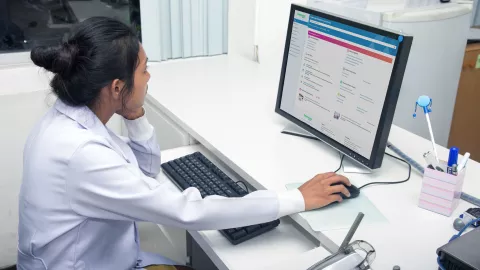 female doctor using computer