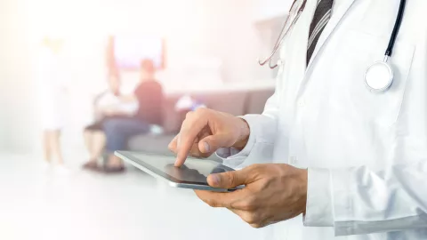 doctor using tablet for healthcare automation